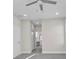 This bedroom features recessed lighting, gray floors, and an ensuite bathroom at 4255 Oak Terrace Cir, Port Charlotte, FL 33953