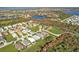 An elevated view captures the community, surrounded by stunning lakes and vibrant green spaces at 4255 Oak Terrace Cir, Port Charlotte, FL 33953