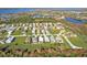 A scenic aerial shot of a residential community near beautiful lakes and recreational areas at 4255 Oak Terrace Cir, Port Charlotte, FL 33953