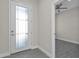 Bright entryway with modern flooring and a glass-paneled front door at 4255 Oak Terrace Cir, Port Charlotte, FL 33953