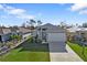 Charming single-story home featuring a well-kept lawn and an attached two-car garage at 4255 Oak Terrace Cir, Port Charlotte, FL 33953