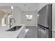 Open kitchen view showcasing stainless steel appliances and elegant finishes at 4255 Oak Terrace Cir, Port Charlotte, FL 33953