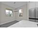Bright kitchen features modern light fixture, gray flooring and white countertops at 4255 Oak Terrace Cir, Port Charlotte, FL 33953