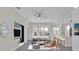 A modern living room displays a comfortable sofa, tv, bar stools and stylish accents, creating an inviting space at 4255 Oak Terrace Cir, Port Charlotte, FL 33953