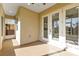 Enclosed porch with ceiling fan, exterior views, and access to both the yard and interior at 4255 Oak Terrace Cir, Port Charlotte, FL 33953