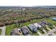 Street view of the homes, showing manicured lawns, lush landscaping, and pristine driveways at 4255 Oak Terrace Cir, Port Charlotte, FL 33953