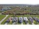 Street view of the homes, showing manicured lawns, lush landscaping, and pristine driveways at 4255 Oak Terrace Cir, Port Charlotte, FL 33953