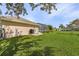 Large backyard with lush green grass, perfect for outdoor activities and enjoying the beautiful surroundings at 7417 S Blue Sage, Punta Gorda, FL 33955