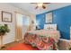 Colorful bedroom with vibrant decor, a comfortable bed, and plenty of natural light from the window at 7417 S Blue Sage, Punta Gorda, FL 33955