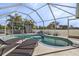 Relax by the pool with sun loungers, enjoy a swim, and bask in the sunshine in this private screened-in oasis at 7417 S Blue Sage, Punta Gorda, FL 33955