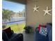 Relaxing screened porch overlooking a lake at 8647 Lake Front Ct, Punta Gorda, FL 33950