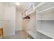 Bright walk-in closet with ample shelving and hanging space at 9011 Midnight Pass Rd # 329, Sarasota, FL 34242