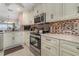 Updated kitchen with granite countertops and stainless steel appliances at 9011 Midnight Pass Rd # 329, Sarasota, FL 34242