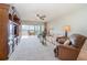 Living area features water views, comfy seating, and access to balcony at 9011 Midnight Pass Rd # 329, Sarasota, FL 34242