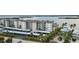 Aerial view of a waterfront building with covered parking at 9011 Midnight Pass Rd # 329, Sarasota, FL 34242