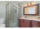 Bathroom with a shower and updated vanity at 9011 Midnight Pass Rd # 329, Sarasota, FL 34242