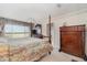 Main bedroom with large bed, dresser and water views at 9011 Midnight Pass Rd # 329, Sarasota, FL 34242