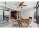 Private lanai with glass-top table and chairs, perfect for outdoor dining at 9011 Midnight Pass Rd # 329, Sarasota, FL 34242