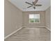 Bright bedroom with ceiling fan and large window at 3640 Eagle Pass St, North Port, FL 34286