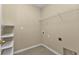 Laundry room with shelving and hookups at 3640 Eagle Pass St, North Port, FL 34286