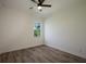 Bright bedroom with wood-look floors and ceiling fan at 14294 Mcfarland Ave, Port Charlotte, FL 33981