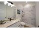 Clean bathroom with marble shower and vanity at 14294 Mcfarland Ave, Port Charlotte, FL 33981