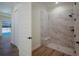 Walk-in shower with marble tile and built-in seat at 14294 Mcfarland Ave, Port Charlotte, FL 33981