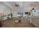 Open living area with hardwood floors, fireplace, and access to the pool at 14294 Mcfarland Ave, Port Charlotte, FL 33981