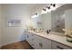 Elegant bathroom with double vanity, quartz countertop, and large mirror at 14294 Mcfarland Ave, Port Charlotte, FL 33981