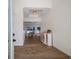 Bright and airy entryway with wood-look flooring and view of living area at 14294 Mcfarland Ave, Port Charlotte, FL 33981