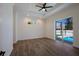 Spacious bedroom with wood-look floors and sliding glass doors to the pool at 14294 Mcfarland Ave, Port Charlotte, FL 33981