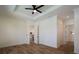 Bright bedroom with wood-look floors and doors to kitchen at 14294 Mcfarland Ave, Port Charlotte, FL 33981