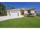 New construction home with two-car garage and stone accents at 14294 Mcfarland Ave, Port Charlotte, FL 33981
