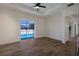 Spacious bedroom with wood-look floors and sliding glass doors to the pool at 14294 Mcfarland Ave, Port Charlotte, FL 33981