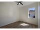 Bright bedroom with wood-look floors and window view at 14294 Mcfarland Ave, Port Charlotte, FL 33981
