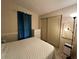 Bedroom with double bed and sliding door closet at 707 Riverview Cir, North Port, FL 34287