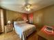 Comfortable bedroom with a double bed and wooden furniture at 707 Riverview Cir, North Port, FL 34287