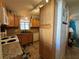 Kitchen with wood cabinets, granite countertops, and a pantry at 707 Riverview Cir, North Port, FL 34287