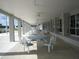 Covered patio area with tables and chairs at 707 Riverview Cir, North Port, FL 34287