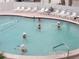Refreshing community pool with plenty of lounge chairs at 707 Riverview Cir, North Port, FL 34287
