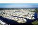 Aerial view of waterfront community with many homes at 707 Riverview Cir, North Port, FL 34287