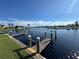 Private wooden dock with access to the canal at 707 Riverview Cir, North Port, FL 34287