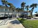 Community center with palm trees and landscaping at 707 Riverview Cir, North Port, FL 34287