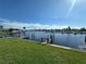 Scenic waterfront view with a private dock at 707 Riverview Cir, North Port, FL 34287