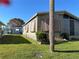 Exterior view of home with palm tree at 707 Riverview Cir, North Port, FL 34287