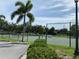 Community tennis court with surrounding fence at 8647 Lake Front Ct, Punta Gorda, FL 33950