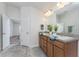 Double vanity bathroom with light wood cabinets and a neutral color scheme at 14062 Hopewell Ave, Port Charlotte, FL 33981