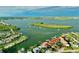 Aerial view of waterfront property with boats and lush greenery at 14062 Hopewell Ave, Port Charlotte, FL 33981