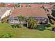Aerial view of house with screened patio and landscaping at 3743 Albacete Cir # 84, Punta Gorda, FL 33950