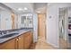 Main bathroom with double sinks, granite countertop, and shower at 3743 Albacete Cir # 84, Punta Gorda, FL 33950